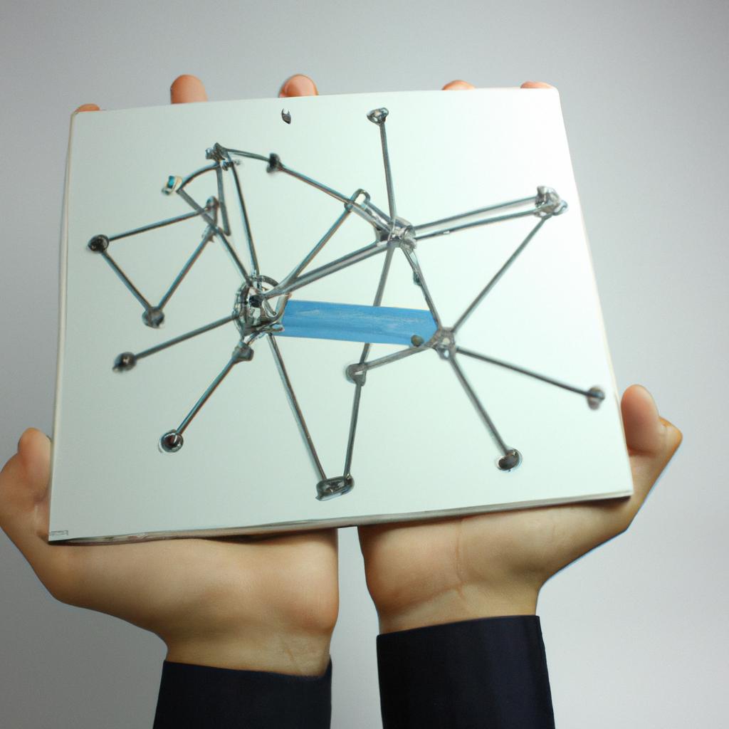 Person holding computer network diagram